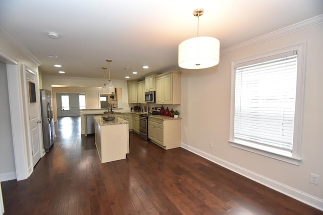 kitchen with kitchen peninsula, a kitchen island, light stone countertops, appliances with stainless steel finishes, and pendant lighting