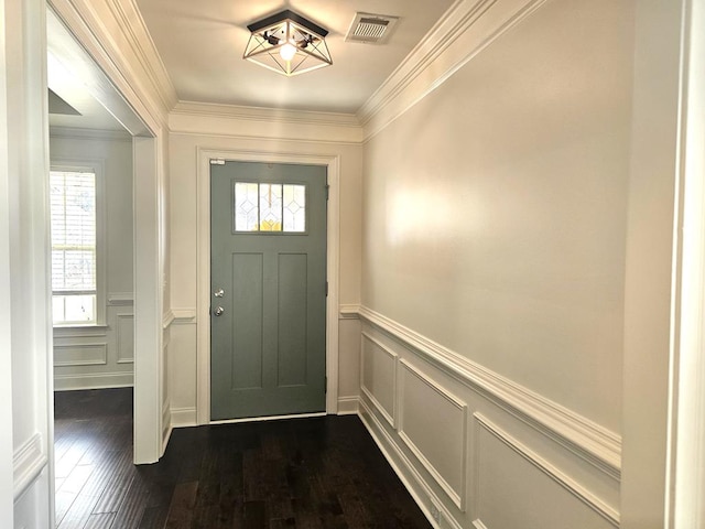 entryway featuring crown molding, dark hardwood / wood-style flooring, and plenty of natural light