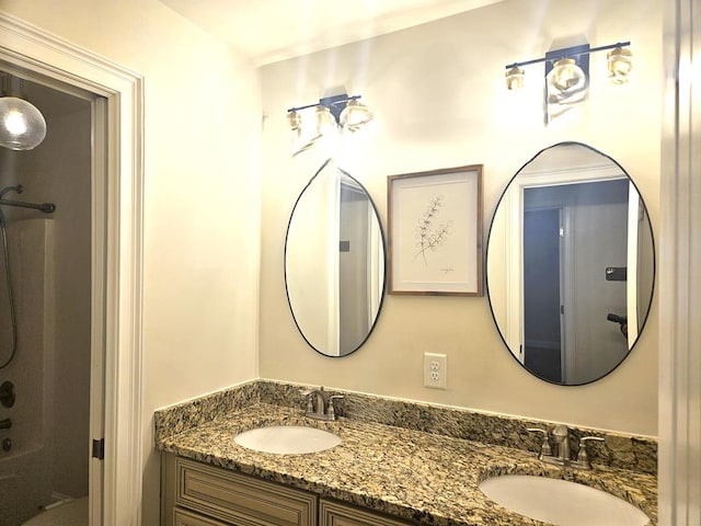 bathroom with vanity and shower / washtub combination