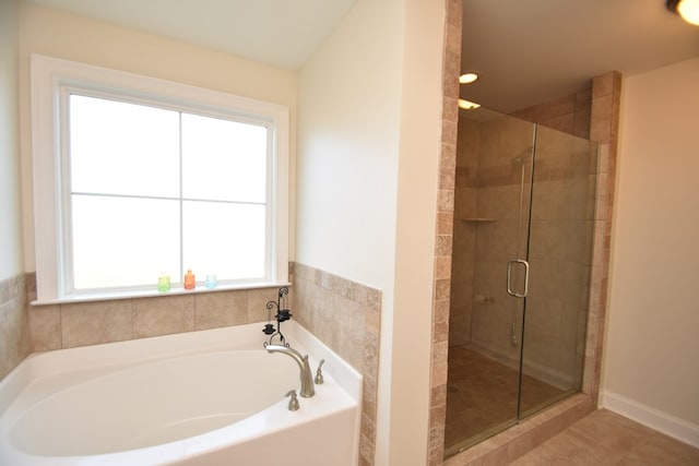 bathroom with plus walk in shower and tile patterned flooring