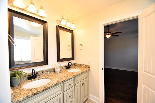 bathroom with vanity, hardwood / wood-style floors, and ceiling fan