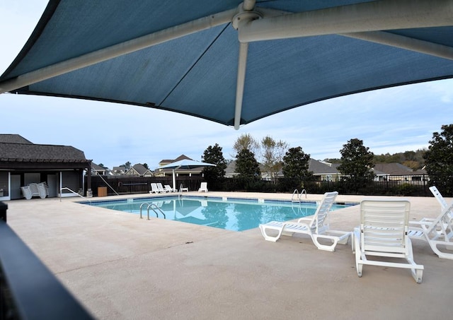 view of swimming pool featuring a patio area