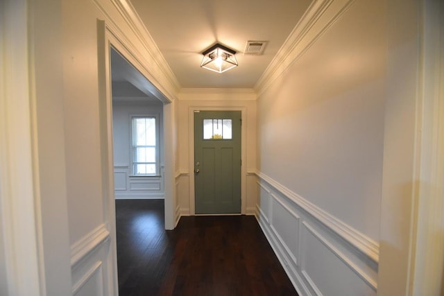 doorway to outside featuring crown molding and dark hardwood / wood-style floors