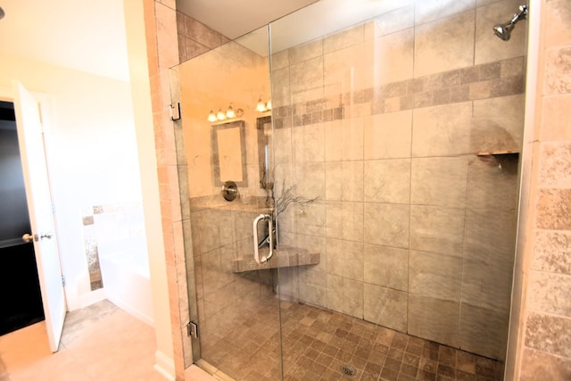 bathroom with a shower with door