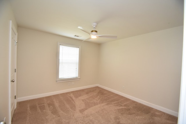 unfurnished room with carpet floors and ceiling fan