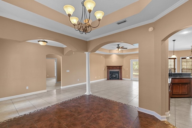 170 County Road 751, Enterprise, AL 36330 - unfurnished living room with a tray ceiling, tile patterned floors, a ceiling fan, arched walkways, and ornamental molding