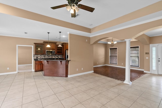 170 County Road 751, Enterprise, AL 36330 - kitchen with appliances with stainless steel finishes, arched walkways, light tile patterned floors, a kitchen breakfast bar, and open floor plan