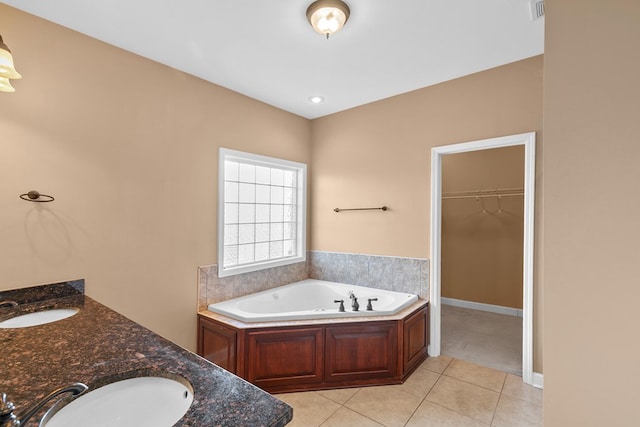 170 County Road 751, Enterprise, AL 36330 - full bathroom with a bath, tile patterned floors, a walk in closet, and double vanity