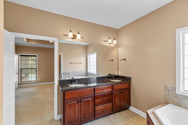 170 County Road 751, Enterprise, AL 36330 - bathroom with double vanity, a bath, healthy amount of natural light, and tile patterned floors
