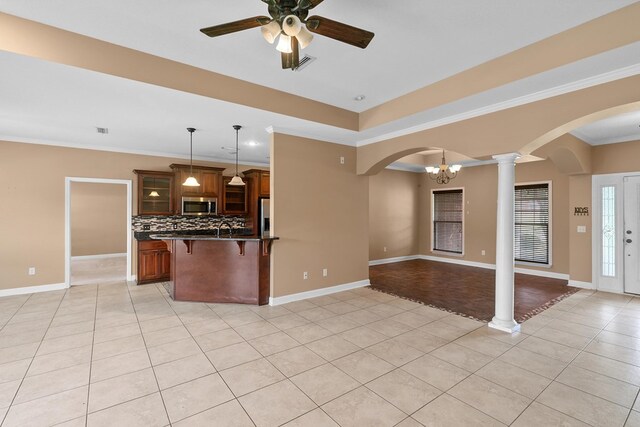 170 County Road 751, Enterprise, AL 36330 - kitchen with appliances with stainless steel finishes, arched walkways, light tile patterned floors, a kitchen breakfast bar, and open floor plan