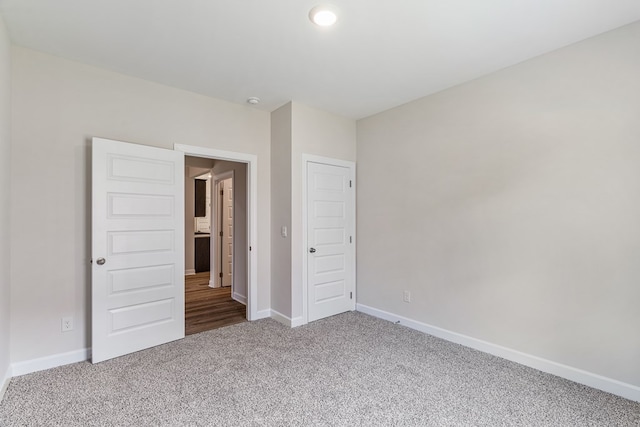 unfurnished bedroom with carpet floors