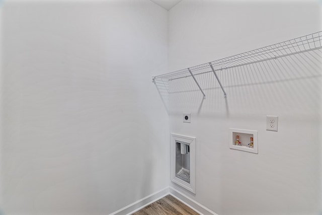 washroom with hookup for an electric dryer, hardwood / wood-style floors, and hookup for a washing machine