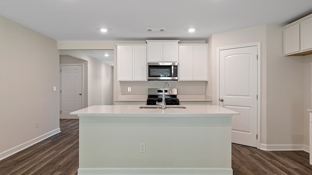 kitchen featuring white cabinetry, a kitchen island with sink, and appliances with stainless steel finishes