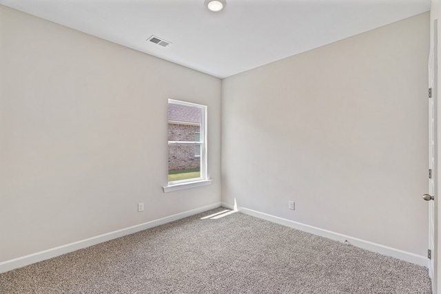 unfurnished room featuring carpet flooring