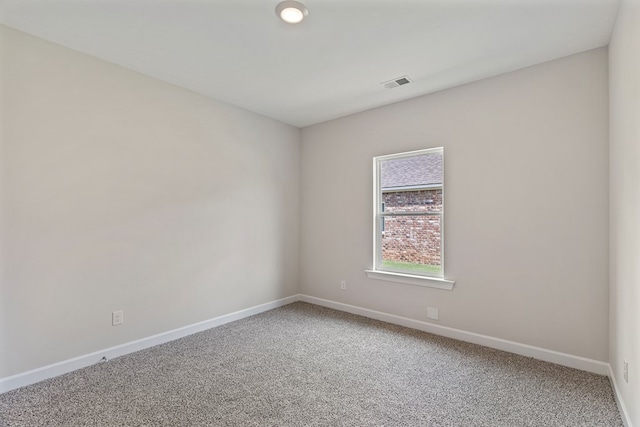 spare room featuring carpet floors