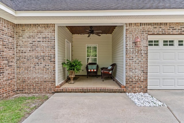 property entrance featuring brick siding, a ceiling fan, an attached garage, and a shingled roof