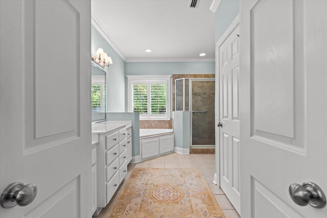 bathroom with tile patterned flooring, ornamental molding, a garden tub, vanity, and a stall shower