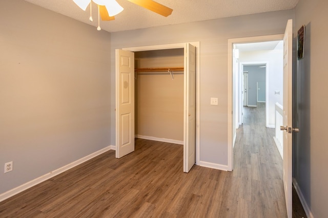 unfurnished bedroom featuring hardwood / wood-style floors, a textured ceiling, a closet, and ceiling fan