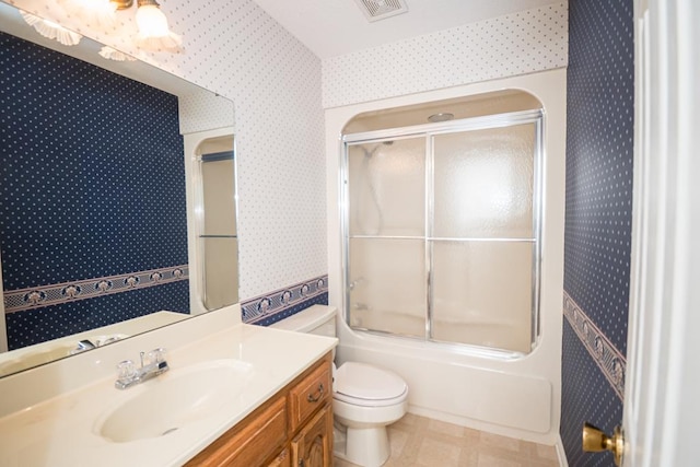 full bathroom with wallpapered walls, visible vents, toilet, combined bath / shower with glass door, and vanity