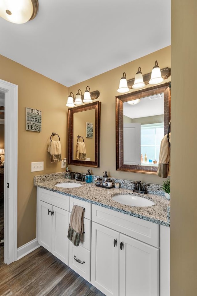 bathroom featuring vanity and wood-type flooring