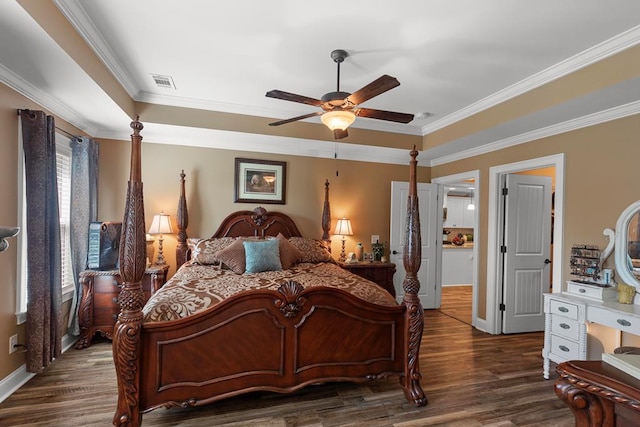 bedroom featuring ceiling fan, dark hardwood / wood-style flooring, and ornamental molding