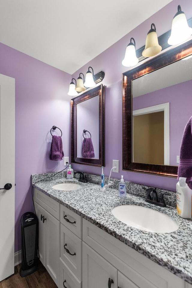 bathroom featuring vanity and wood-type flooring