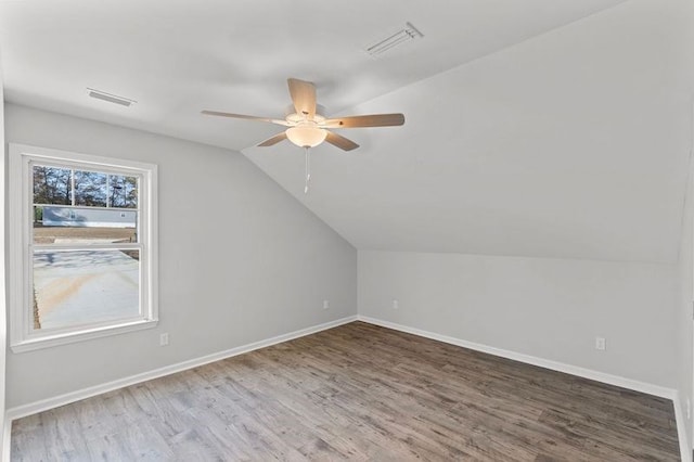 bonus room featuring hardwood / wood-style floors, ceiling fan, and lofted ceiling