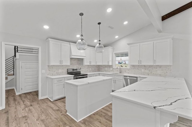 kitchen with white cabinetry, sink, a center island, appliances with stainless steel finishes, and light wood-type flooring