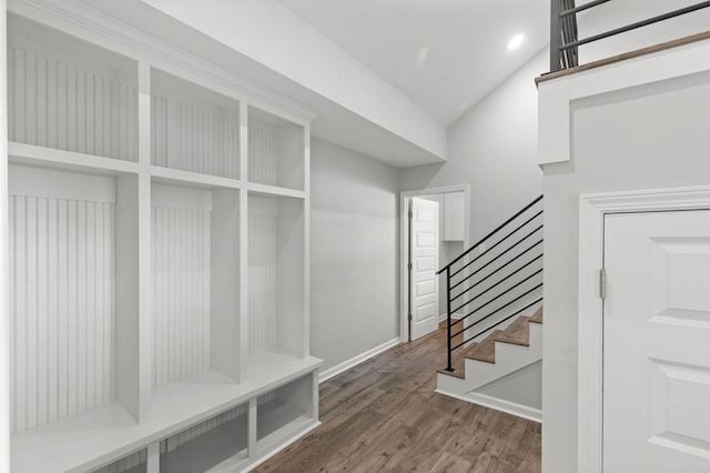 mudroom with vaulted ceiling and hardwood / wood-style flooring