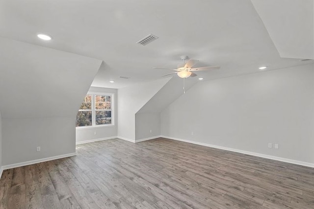 bonus room featuring hardwood / wood-style flooring, ceiling fan, and vaulted ceiling