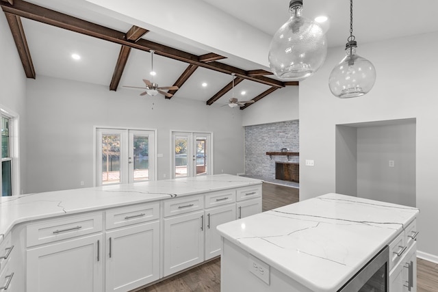 kitchen featuring white cabinetry, french doors, dark wood-type flooring, and plenty of natural light