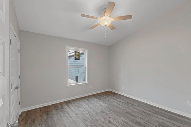 unfurnished room featuring ceiling fan and hardwood / wood-style flooring