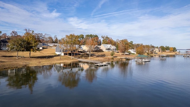 property view of water with a dock