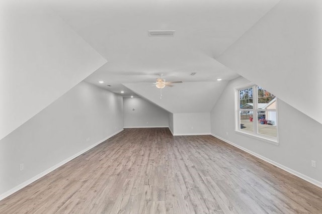 additional living space with ceiling fan, light hardwood / wood-style floors, and lofted ceiling