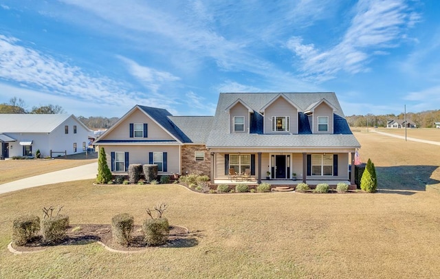 view of front of house featuring a front lawn and covered porch