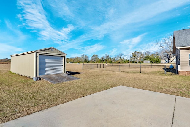 view of yard with an outdoor structure and a patio area