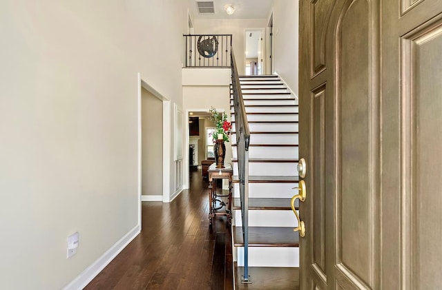 foyer entrance with dark wood-type flooring