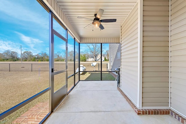 sunroom / solarium with ceiling fan