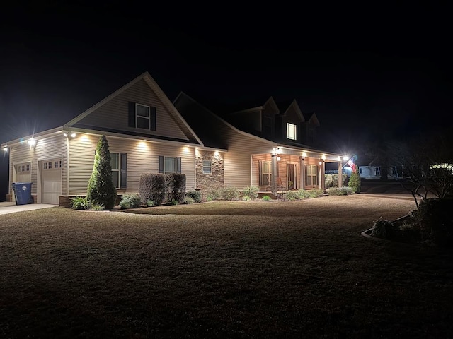 new england style home with a porch and a garage