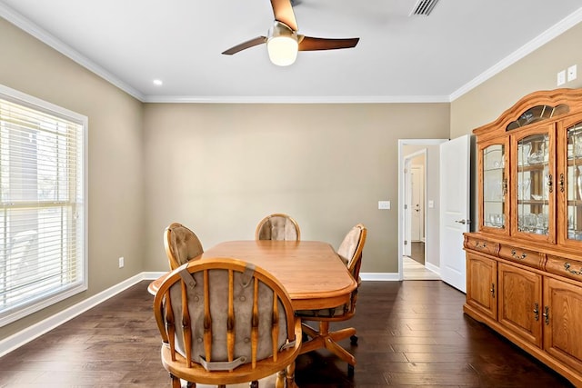 dining room featuring ceiling fan, crown molding, and dark wood-type flooring