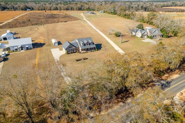 birds eye view of property with a rural view