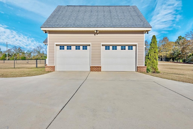 garage featuring a yard