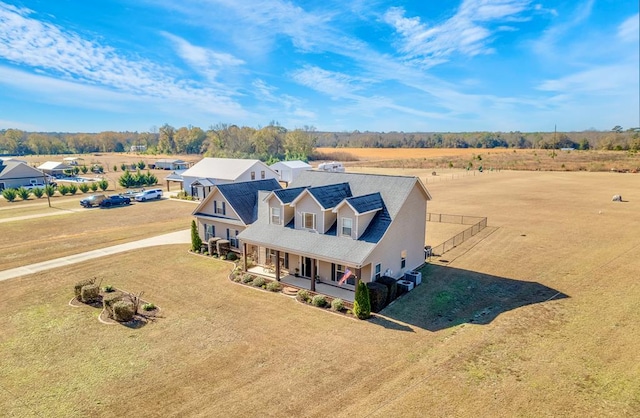 birds eye view of property featuring a rural view