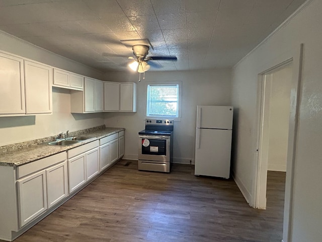 kitchen with sink, electric stove, white fridge, white cabinetry, and dark hardwood / wood-style floors