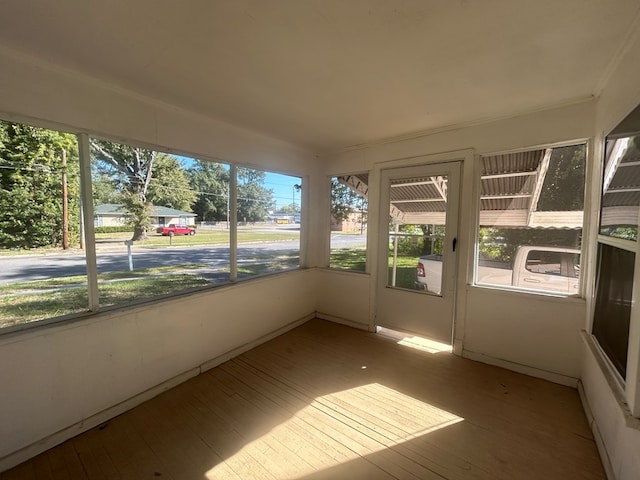 unfurnished sunroom with a wealth of natural light