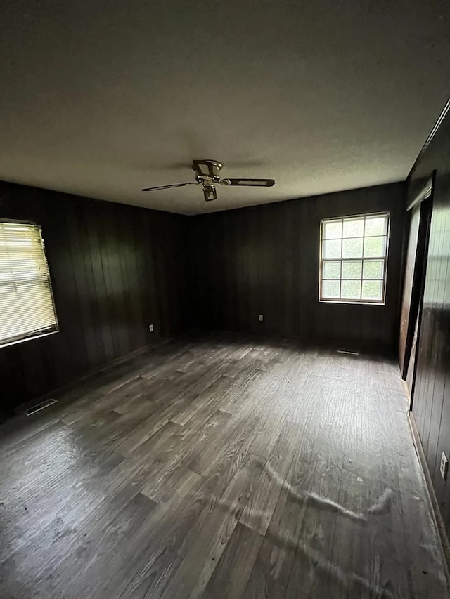 5131 County Rd 417, Kinston, AL 36453 - empty room with wood finished floors, ceiling fan, and wooden walls