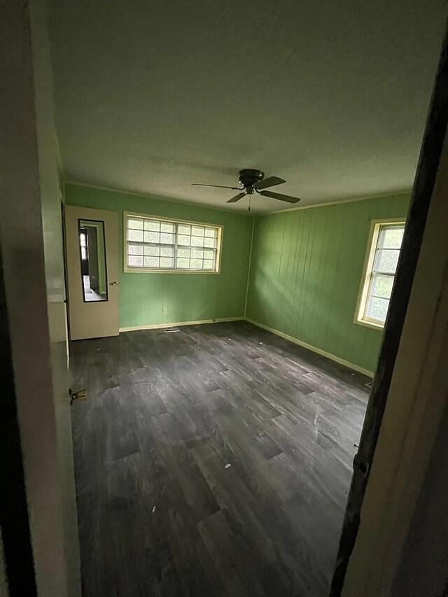 5131 County Rd 417, Kinston, AL 36453 - unfurnished room with a ceiling fan and dark wood-style floors
