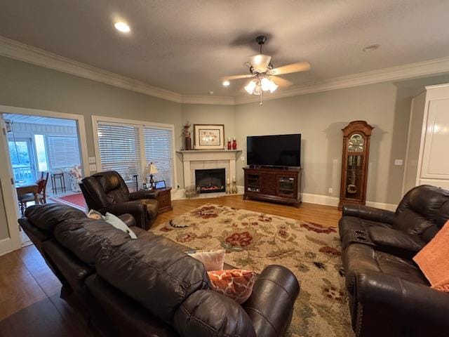 208 Craftsman Dr, Dothan, AL 36303 - living area with ceiling fan, wood finished floors, ornamental molding, recessed lighting, and a fireplace