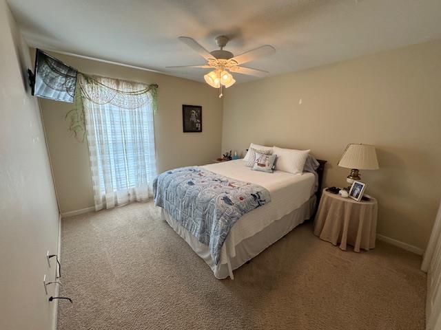 208 Craftsman Dr, Dothan, AL 36303 - bedroom with light colored carpet and ceiling fan