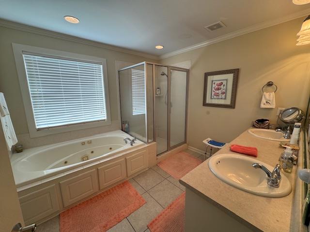 208 Craftsman Dr, Dothan, AL 36303 - full bathroom with a shower stall, a jetted tub, double vanity, crown molding, and tile patterned floors